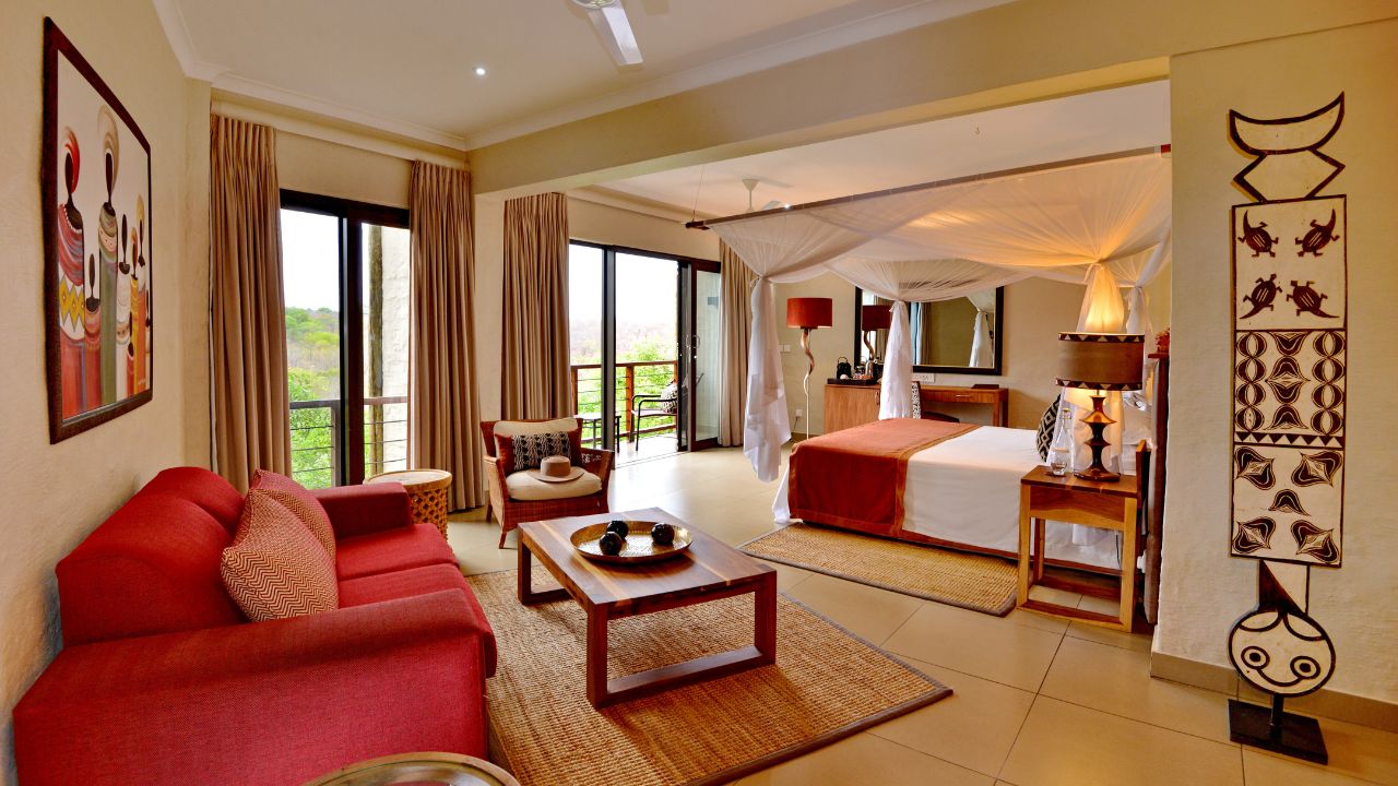 Double guest suite at Victoria Falls Safari Club with view over private deck