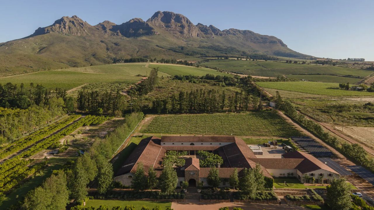 Image of Waterford Estate Wine Farm and Mountains in Background