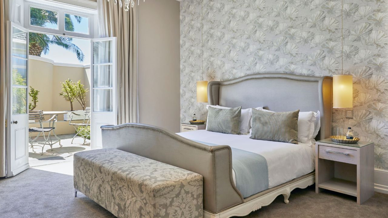 Luxury suite bedroom at Dock House Boutique Hotel, modern Victorian style.