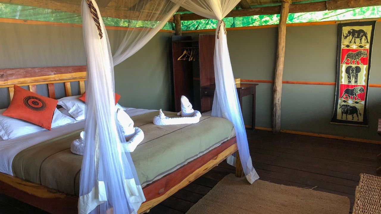 Interior of tented accommodation with double bed, Zambia.