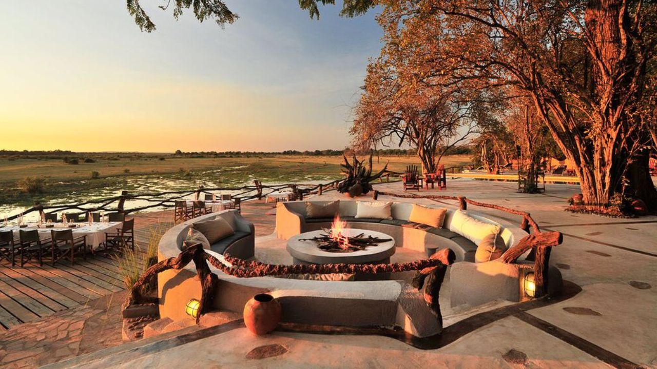 Boma area at sunset with fire lit, overlooking bush for game viewing