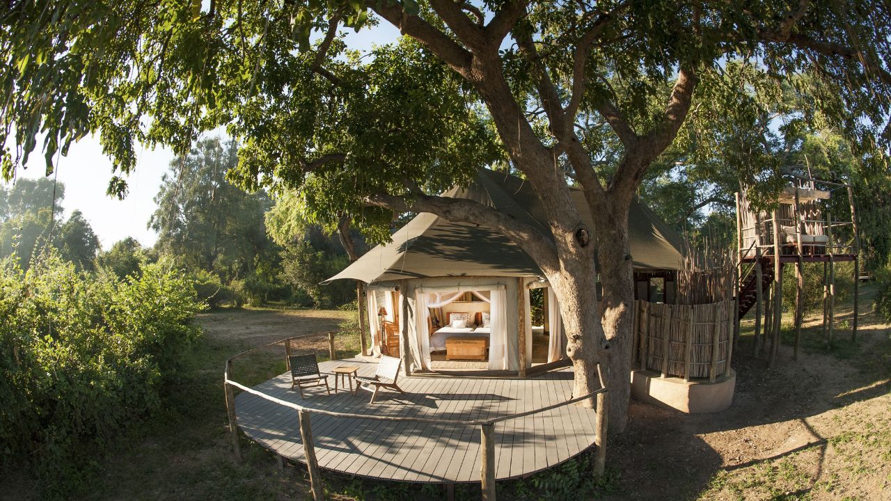 Long-range view of tented guest accommodation at Three Rivers Camp