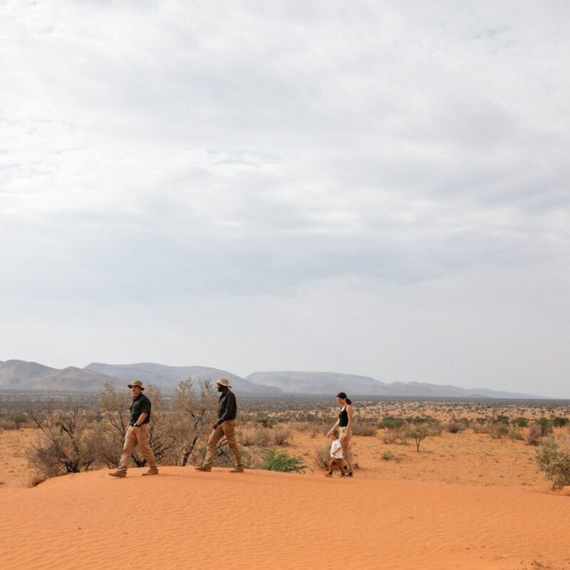 Family exploring Tswalu Kalahari on guided walking safari.
