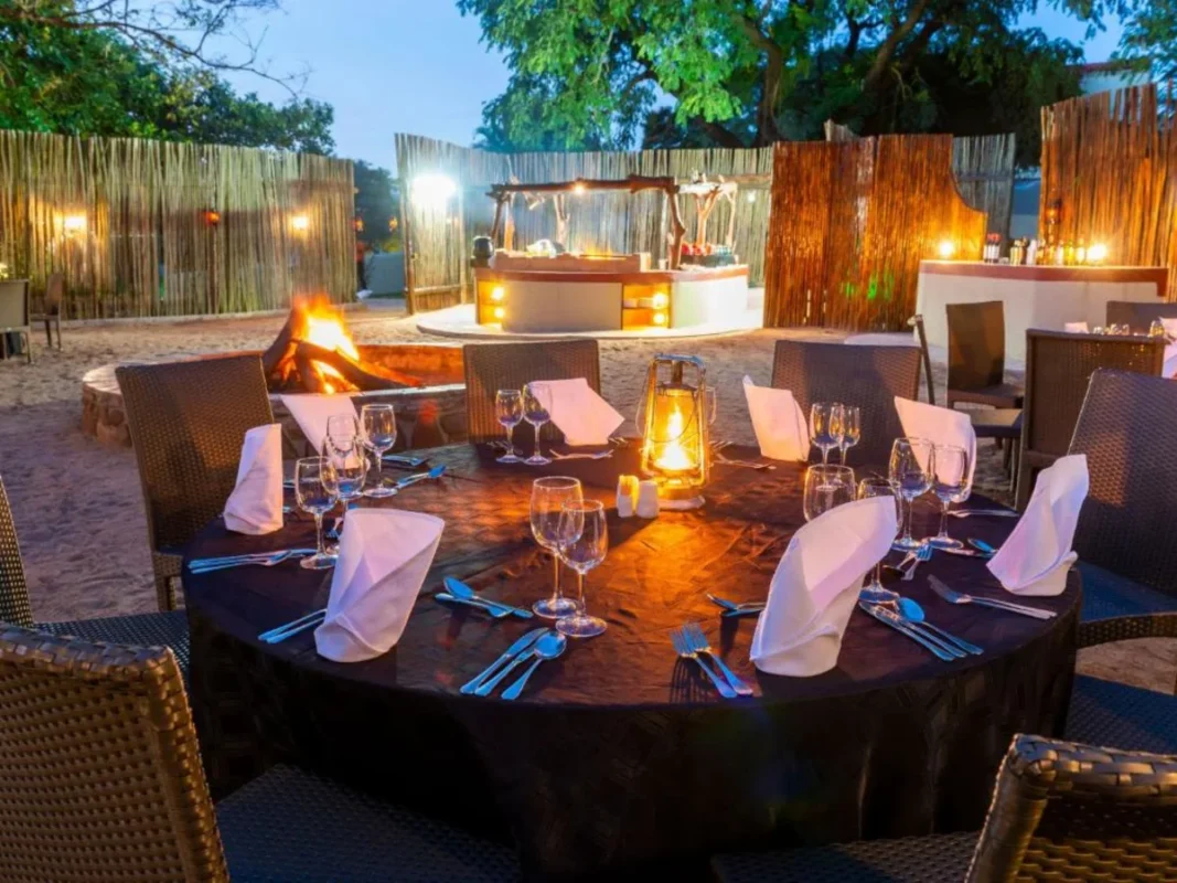 Candlelit outdoor dining area at ANEW Resort Hazyview South Africa.