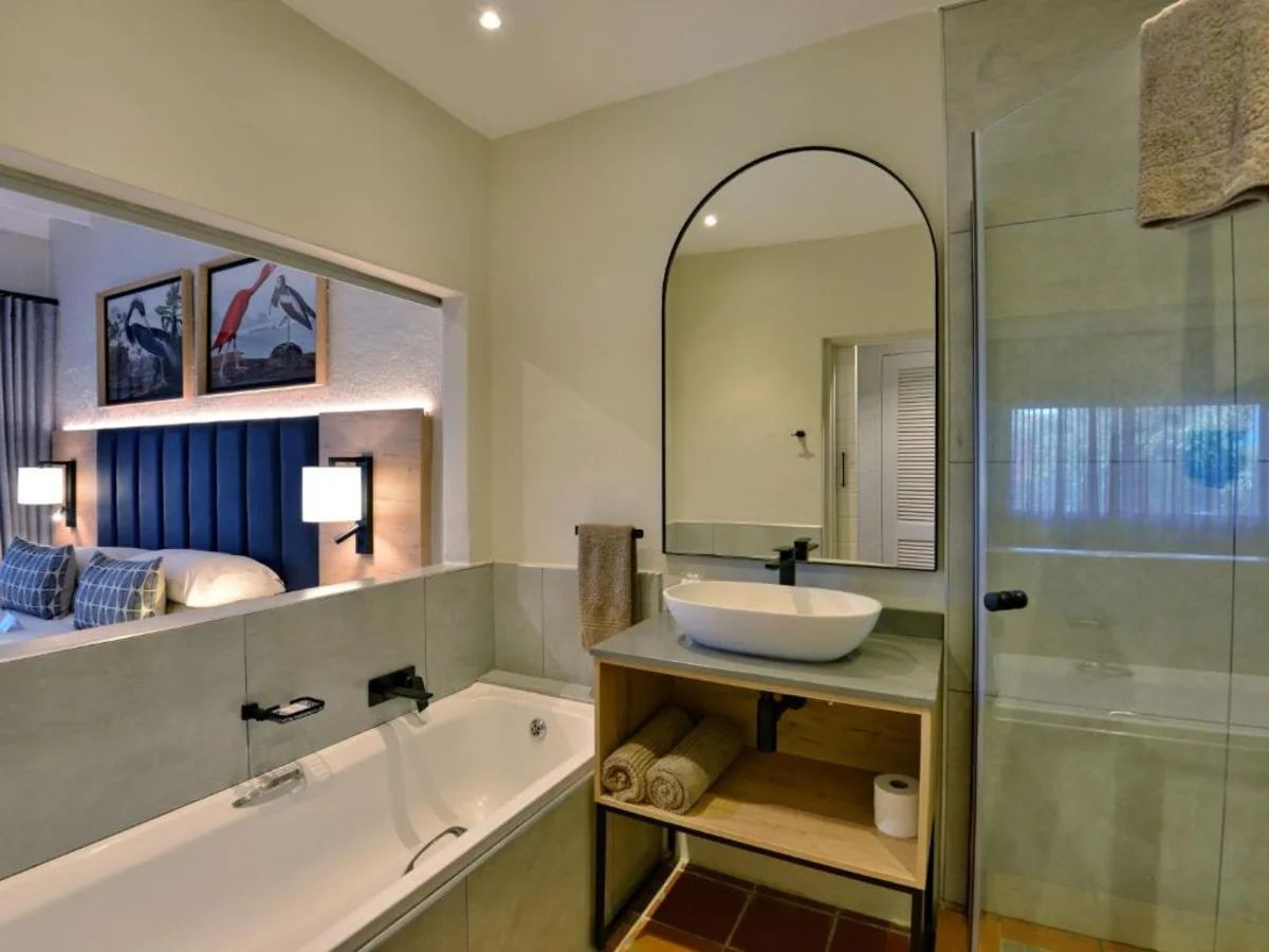 Modern villa bathroom with mirror at ANEW Resort Hazyview.