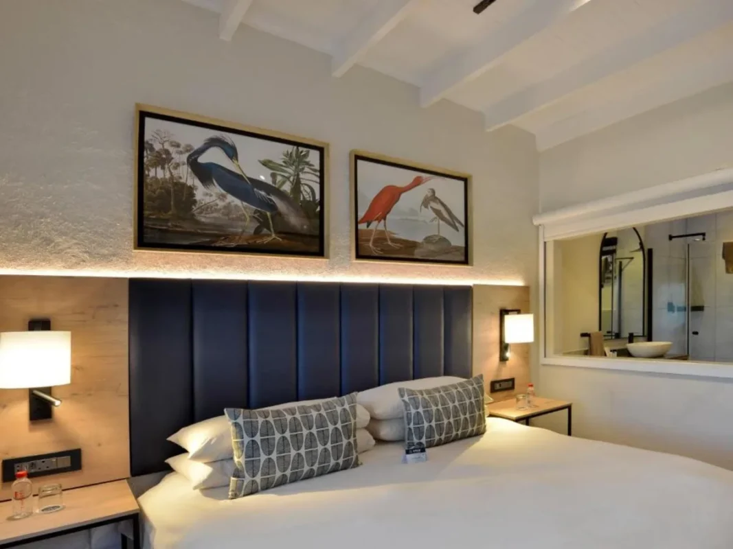 Modern double bed in guest room at ANEW Resort Hazyview.