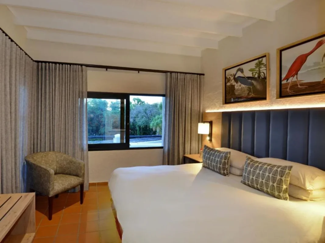 Double bed with outdoor views at ANEW Resort Hazyview South Africa.