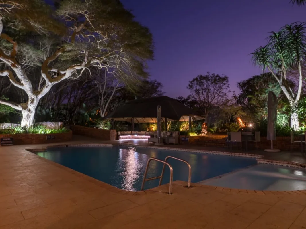 Evening swimming pool and lapa at ANEW Hotel Hluhluwe South Africa.