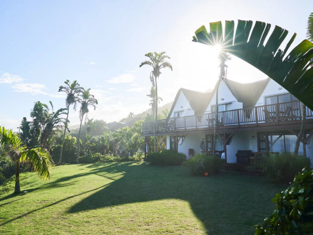Crawford's Beach Lodge chalets surrounded by beautiful gardens.
