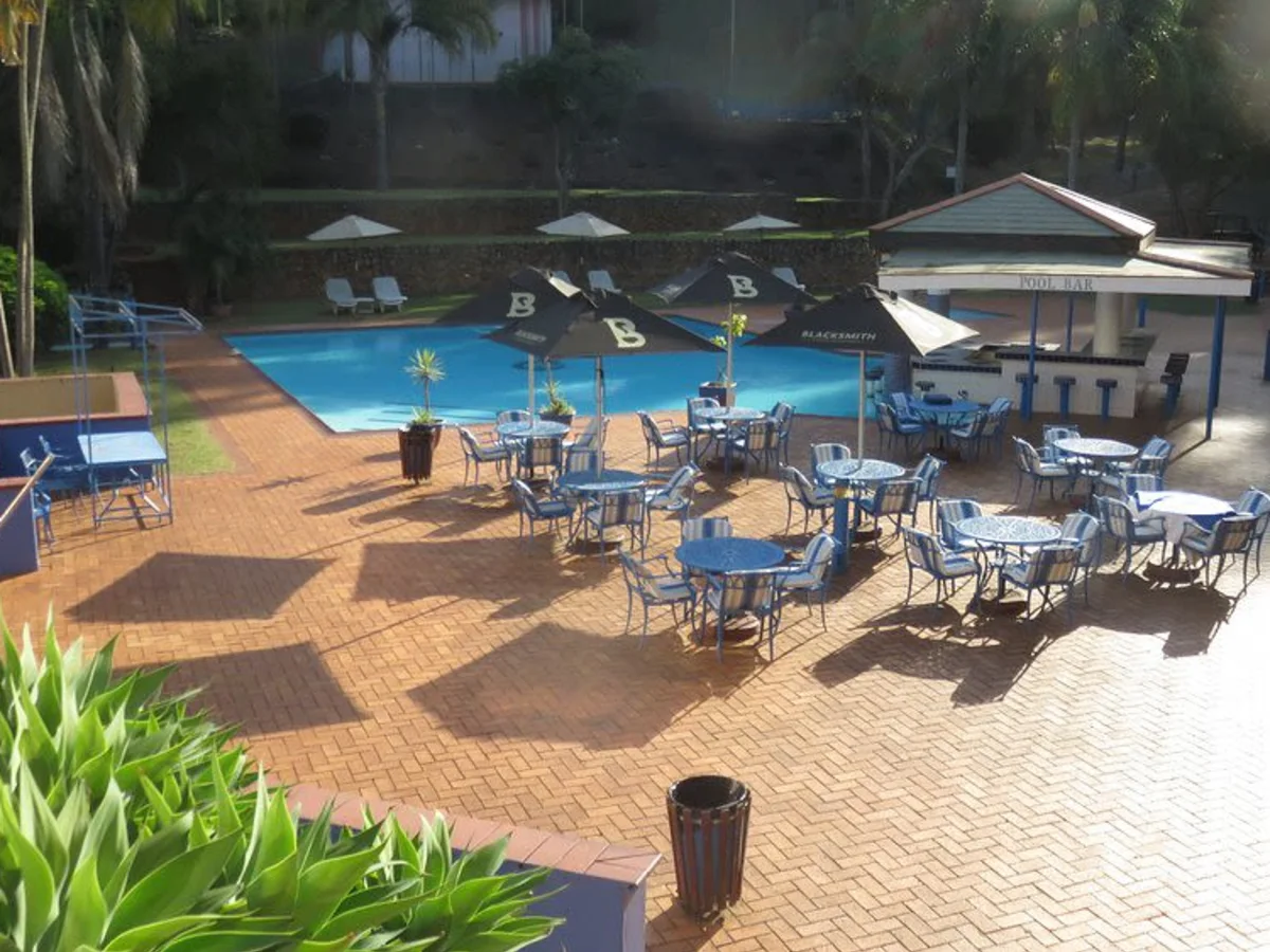 Piggs Peak Hotel & Casino Website: Piggs Peak Hotel & Casino Dates: Jun 9, 2027 Piggs Peak Hotel & Casino is a relaxed mountain-side retreat in northern Eswatini, set among pine trees and manicured lawns with wide views of the Makhonjwa Mountains. The property is positioned for both leisure and business travel, and it is also convenient for guests crossing via nearby border posts or heading toward Kruger National Park. The hotel highlights comfort and convenience in a peaceful setting, with a strong focus on easy access and a tranquil atmosphere. Its room stock includes standard rooms, large corner rooms, and executive suites, giving guests several stay options. Most rooms include en-suite bathrooms, private balconies, TVs, air conditioning, free WiFi, and tea and coffee stations. The large corner rooms can also be configured as family suites through interleading doors. On-site, guests can enjoy a restaurant, pub, pool, gym, massage services, and a craft shop. The hotel also caters to conferences and events, with multiple function rooms and capacity for larger groups. Breakfast is offered buffet-style, with hot and cold dishes and made-to-order items from the chefs. Overall, it is a practical and scenic base for relaxation, events, and regional travel.