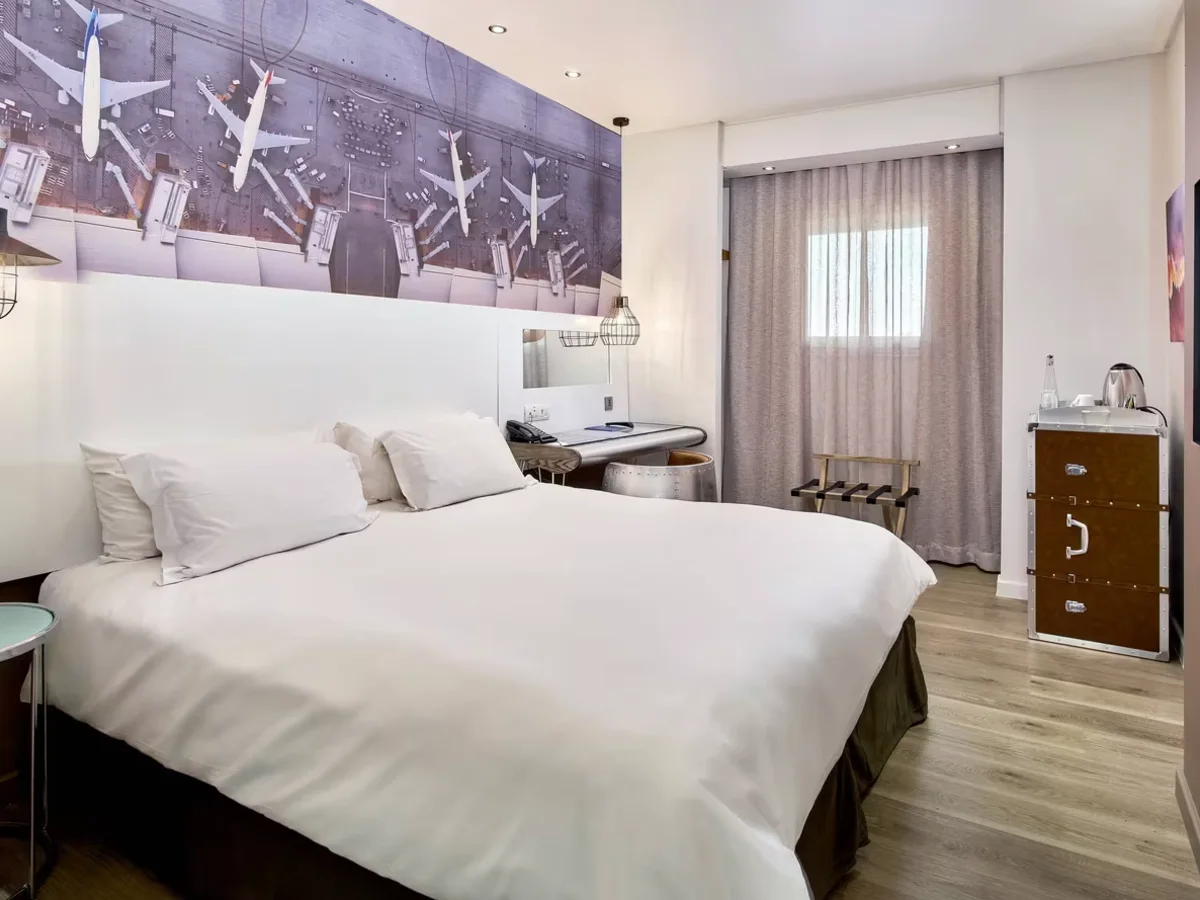 Modern guest room with contemporary artwork at Protea Hotel Johannesburg