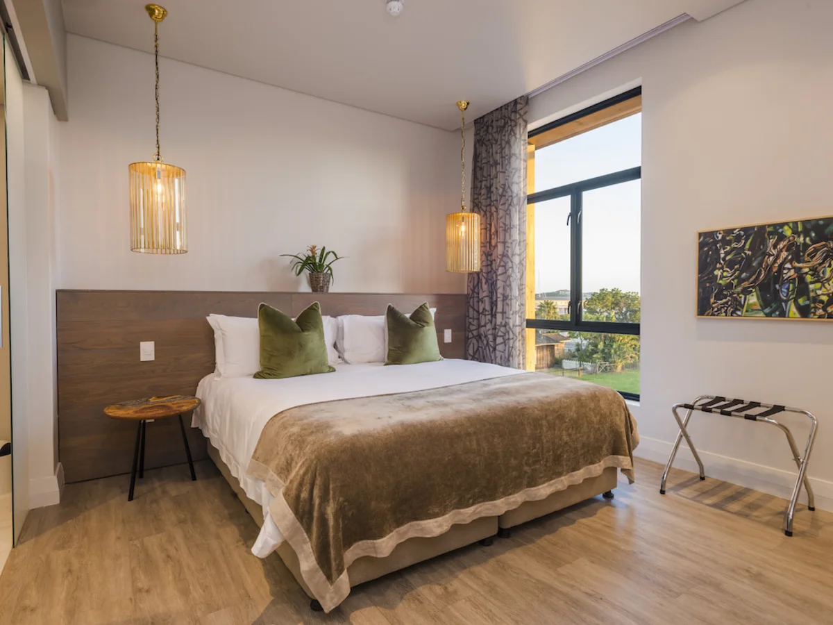 Modern double room with comfortable bed at aha The Rex Hotel Knysna.