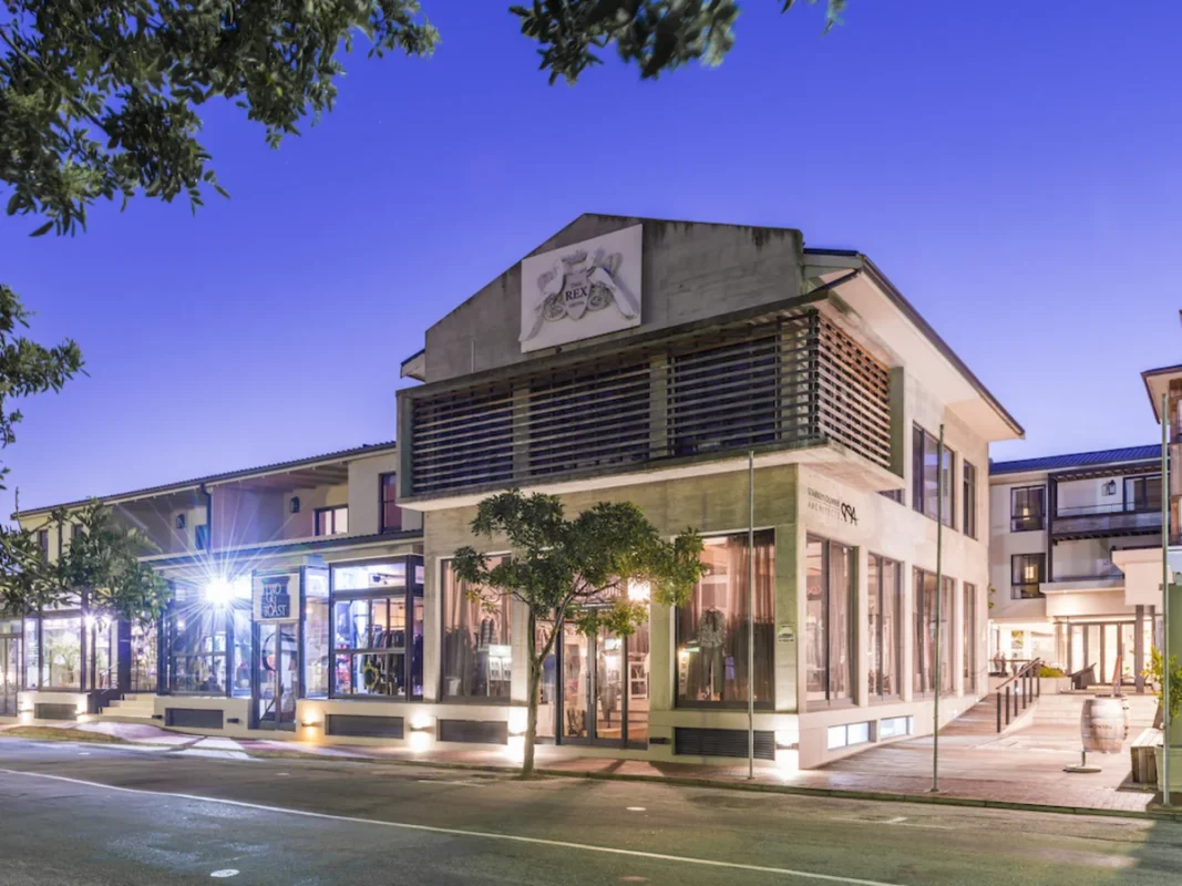 Aha The Rex Hotel Knysna illuminated at night.