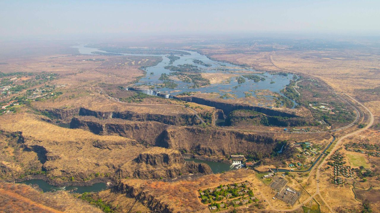 Victoria Falls in the dry winter season with low water levels and dry surroundings.